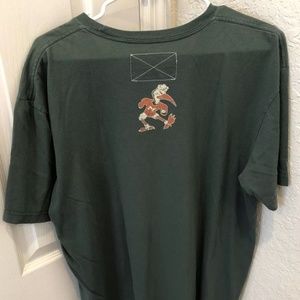 Nike Shirts - Nike Sportswear Miami Hurricanes Helmet T-Shirt Nike Shirts - Nike Sportswear Miami Hurricanes Helmet T-Shirt